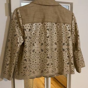 Laser-cut vinyl jacket to dress up your best winter whites, jeans,summer linens.